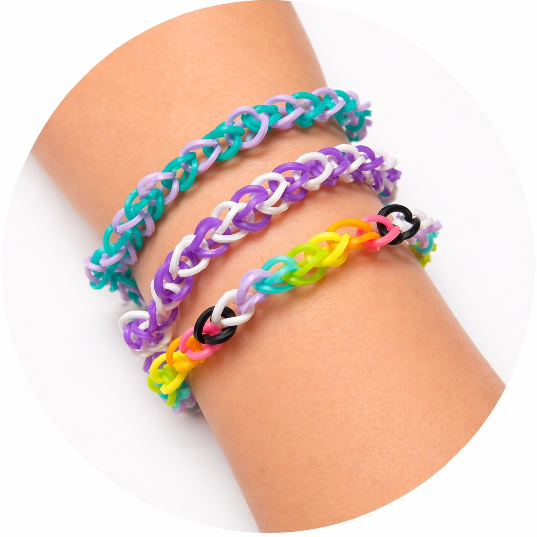 Three handwoven rubber-band bracelets stacked on a child's wrist.